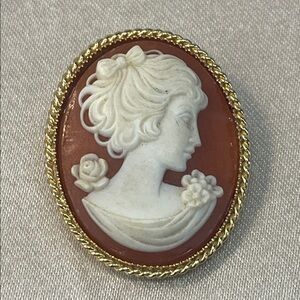 White Cameo Profile Brooch with Coral Background and Gold Trim